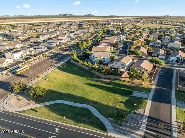 a view of a dining room with furniture and a chandelier