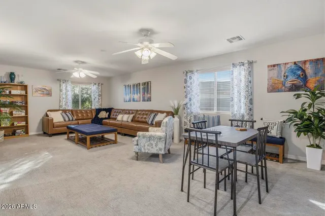 a large bedroom with a bed and a dresser