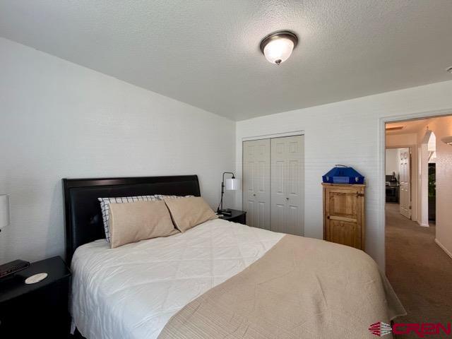 544 20th Street Delta, CO 81416 - Photo 29 of 44 a bedroom with a bed and a lamp