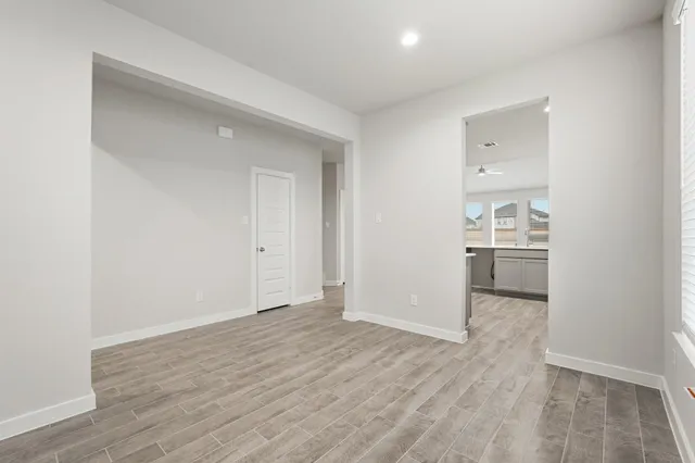 a view of a kitchen cabinets and wooden floor