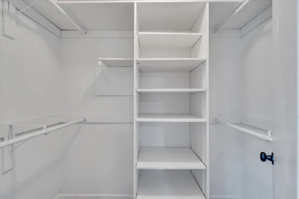 a view of empty room with windows