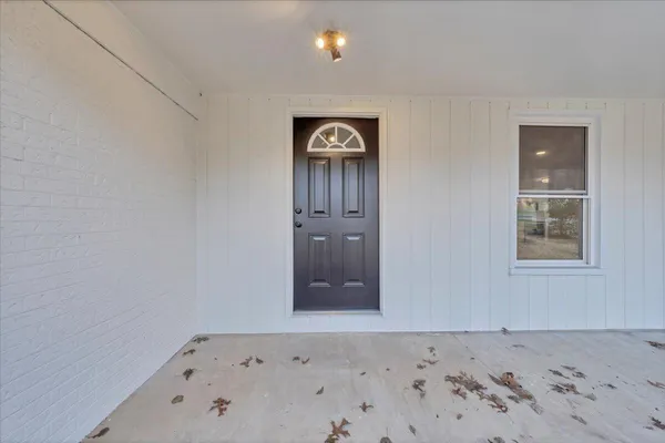 a view of a livingroom with a hardwood floor and a ceiling fan