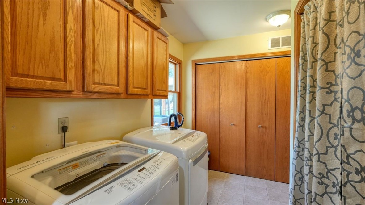63155 Arrowhead Road Cambridge, OH 43725 - Photo 30 of 50 Laundry room featuring independent washer and dryer and light tile floors