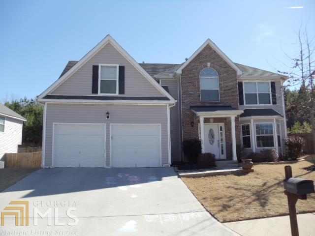 308 Randy Way, Unit 86 Dallas, GA 30132 - Photo 1 of 1 a front view of a house with a yard and garage