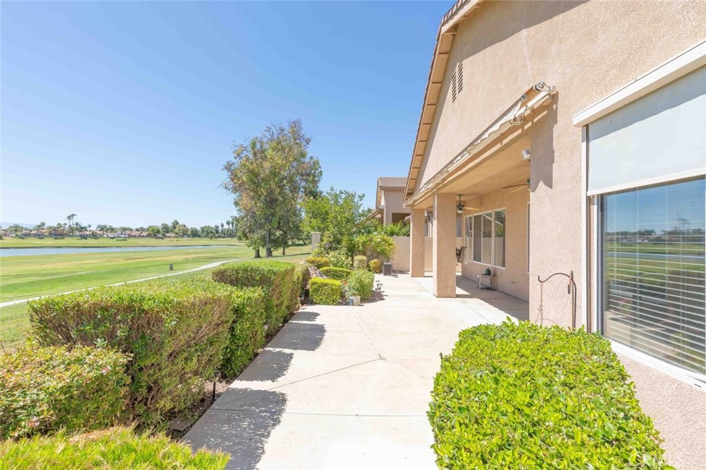29546 Winding Brook Drive Menifee, CA 92584 - Photo 15 of 21 a view of a house with a yard and potted plants