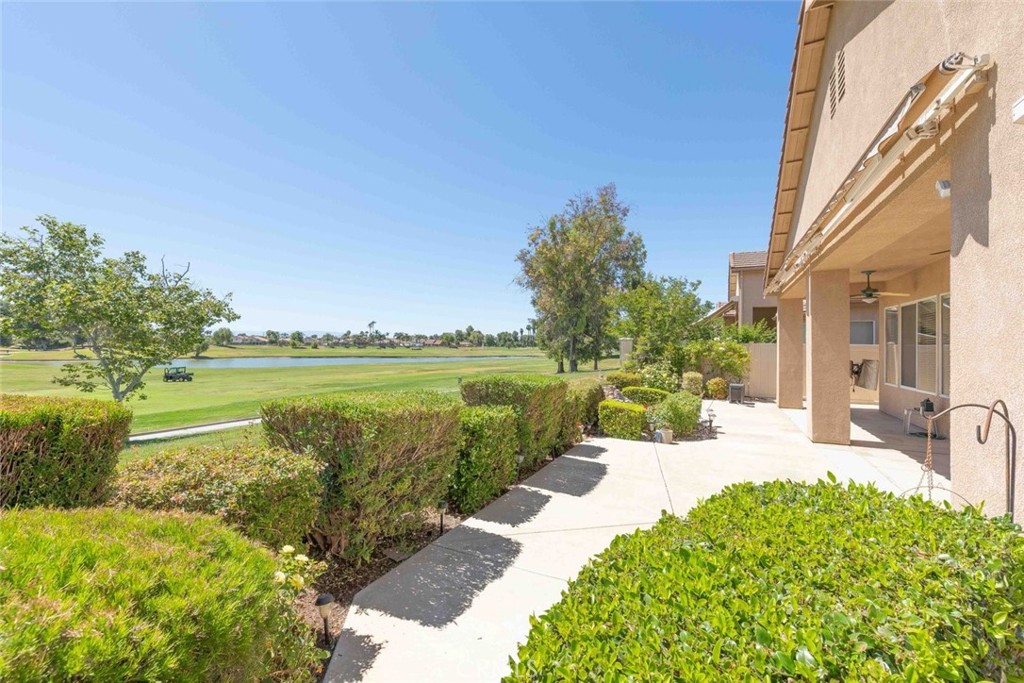 29546 Winding Brook Drive Menifee, CA 92584 - Photo 16 of 21 a view of a swimming pool with a garden