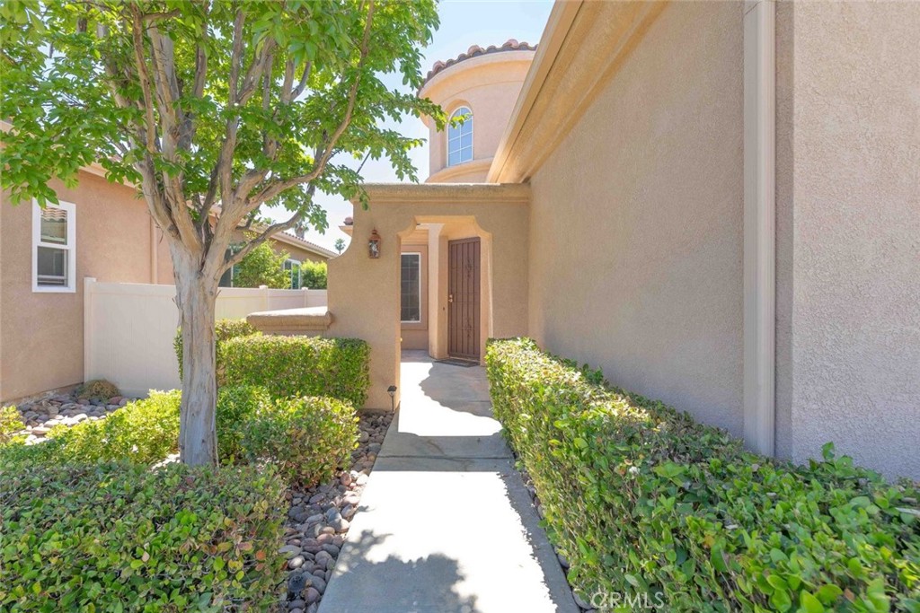 29546 Winding Brook Drive Menifee, CA 92584 - Photo 2 of 21 a front view of a house with a yard