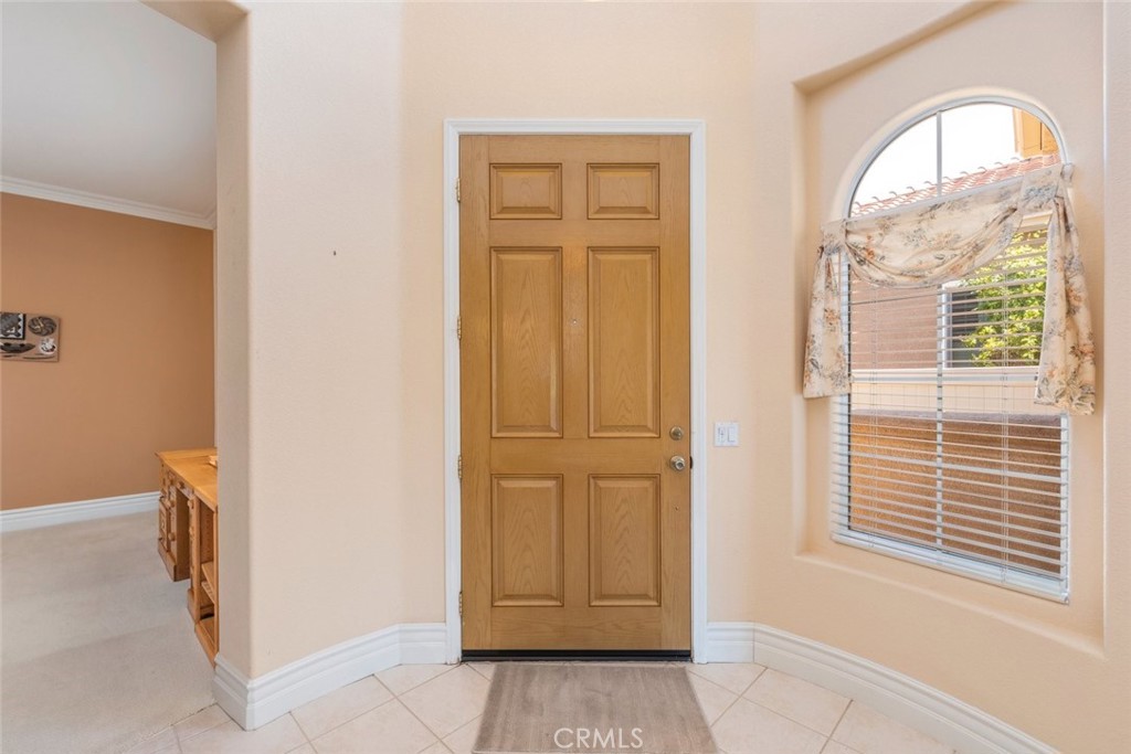 29546 Winding Brook Drive Menifee, CA 92584 - Photo 3 of 21 a view of front door with hallway