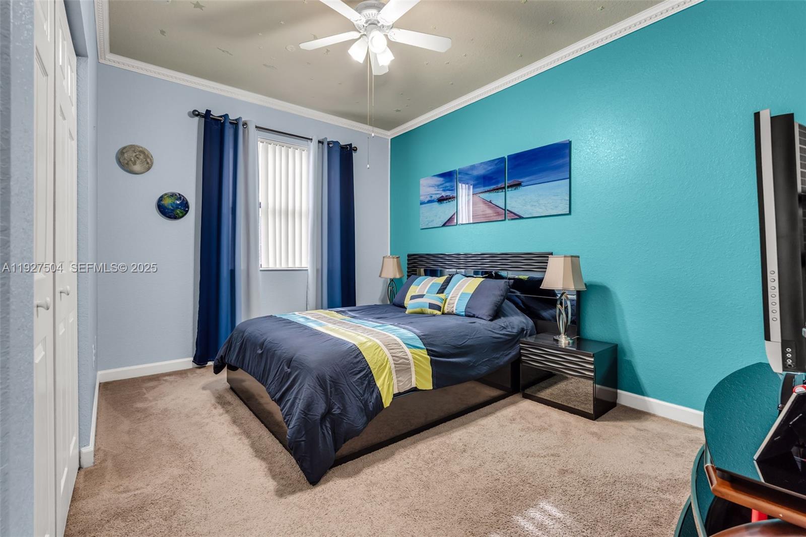 7161 Southwest 163rd Place Miami, FL 33193 - Photo 17 of 39 a bedroom with bed and window