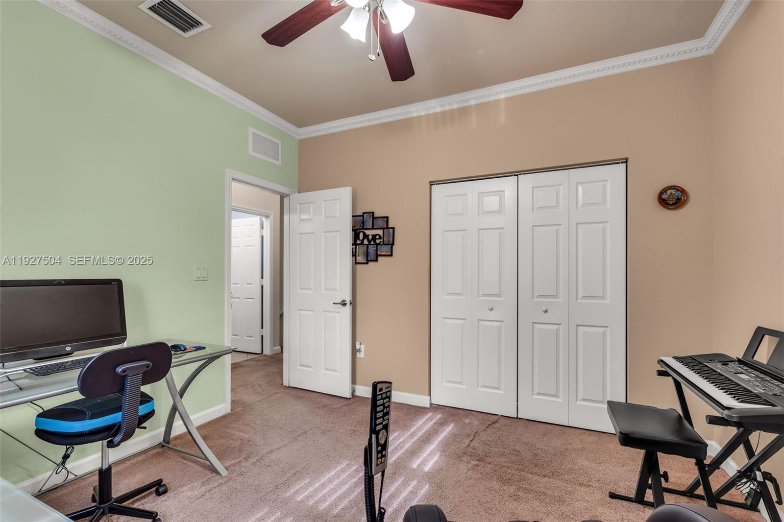 7161 Southwest 163rd Place Miami, FL 33193 - Photo 20 of 39 a living room with furniture and a flat screen tv