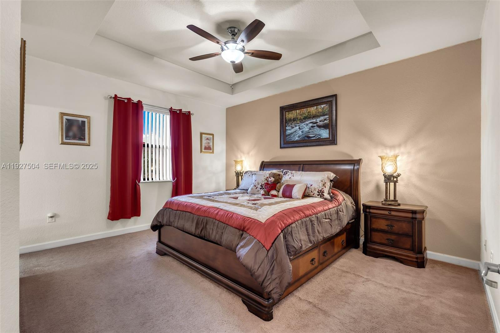 7161 Southwest 163rd Place Miami, FL 33193 - Photo 21 of 39 a spacious bedroom with a bed and a chandelier