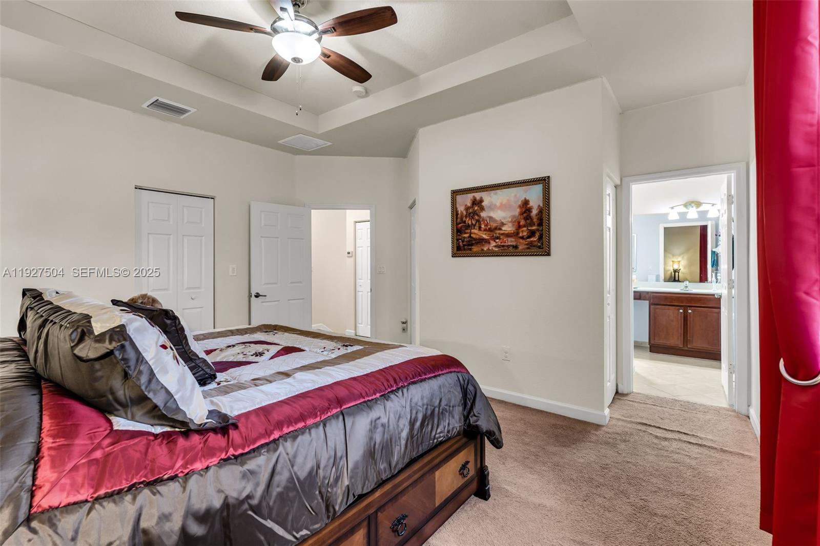 7161 Southwest 163rd Place Miami, FL 33193 - Photo 23 of 39 a bedroom with a bed and a chandelier