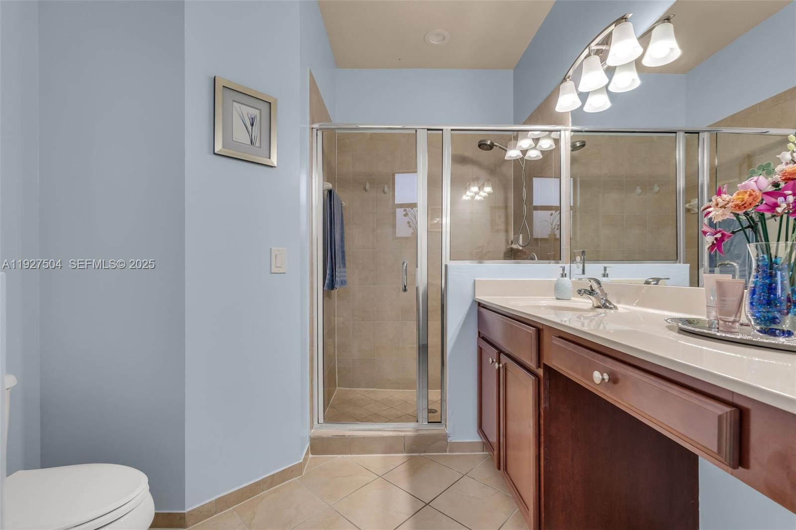7161 Southwest 163rd Place Miami, FL 33193 - Photo 25 of 39 a view of bathroom with a sink mirror and a toilet