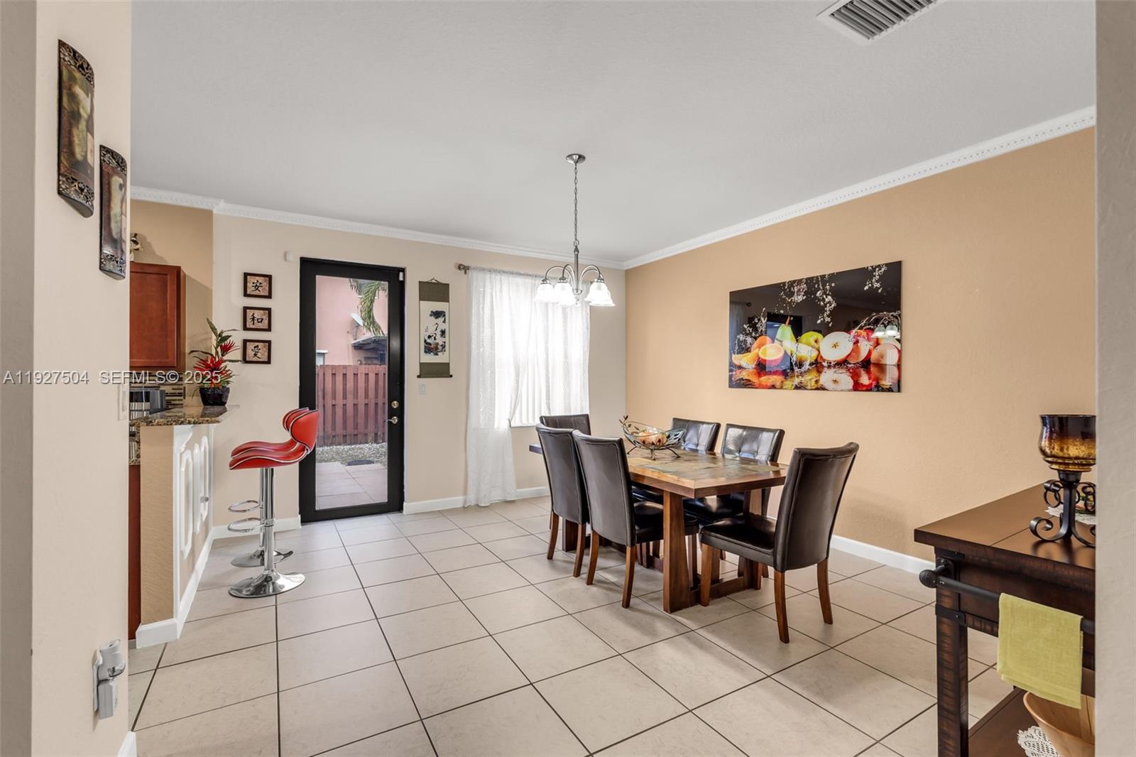 7161 Southwest 163rd Place Miami, FL 33193 - Photo 6 of 39 a view of a dining room with furniture