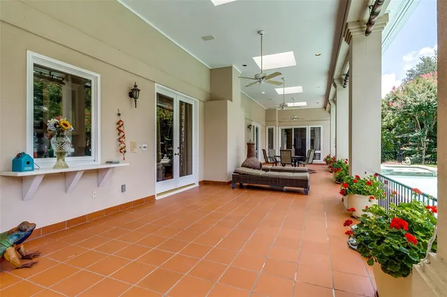 a living room with furniture and flowers
