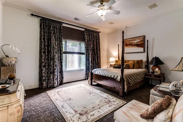 a bedroom with double bed and a window