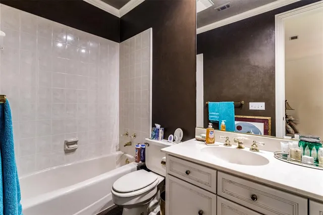 a bathroom with a sink a toilet and a bathtub