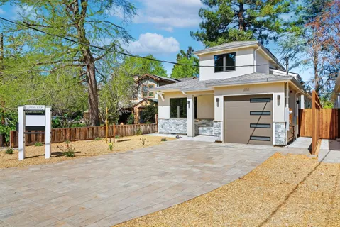 a front view of a house with a garage