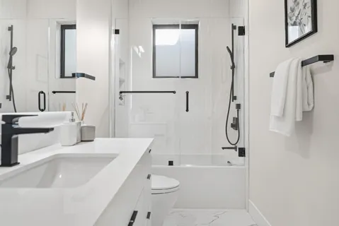 a bathroom with a sink a toilet and a bathtub