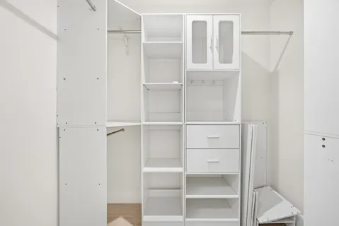 a view of an empty walk in closet
