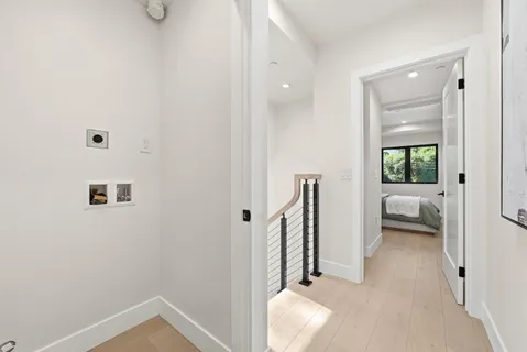 a view of a hallway with a room and a livingroom