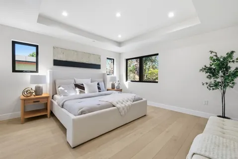 a bedroom with bed and window