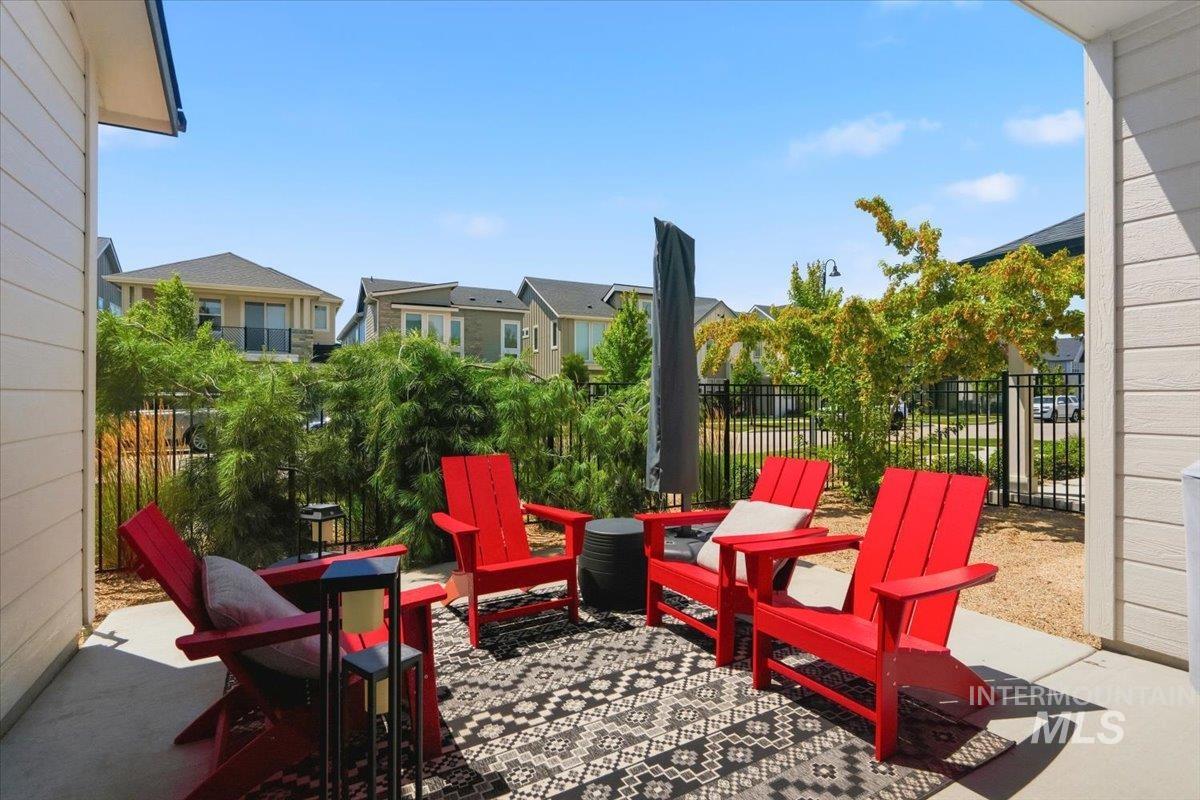 3794 South Single Tree Avenue Boise, ID 83716 - Photo 38 of 50 Covered patio featuring a concrete surface and a patterned outdoor rug