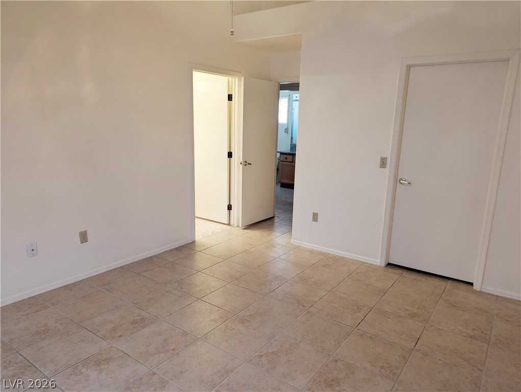 9433 Quail Ridge Drive Las Vegas, NV 89134 - Photo 8 of 23 Clean, spacious area with durable tile flooring and multiple entryways for adaptable living.