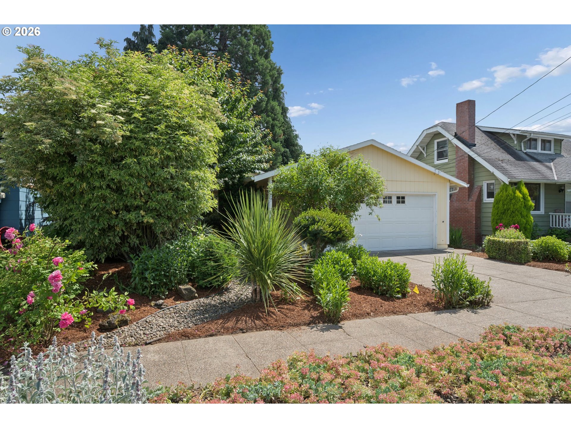 255 West Berkeley Street Gladstone, OR 97027 - Photo 2 of 37 a front view of a house with a yard and potted plants