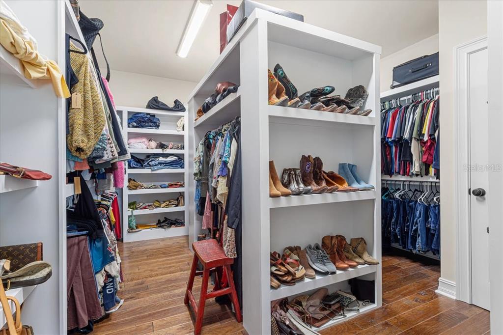 4107 Southwest State Road 45 Newberry, FL 32669 - Photo 11 of 100 a view of walk in closet with clothes and shoes