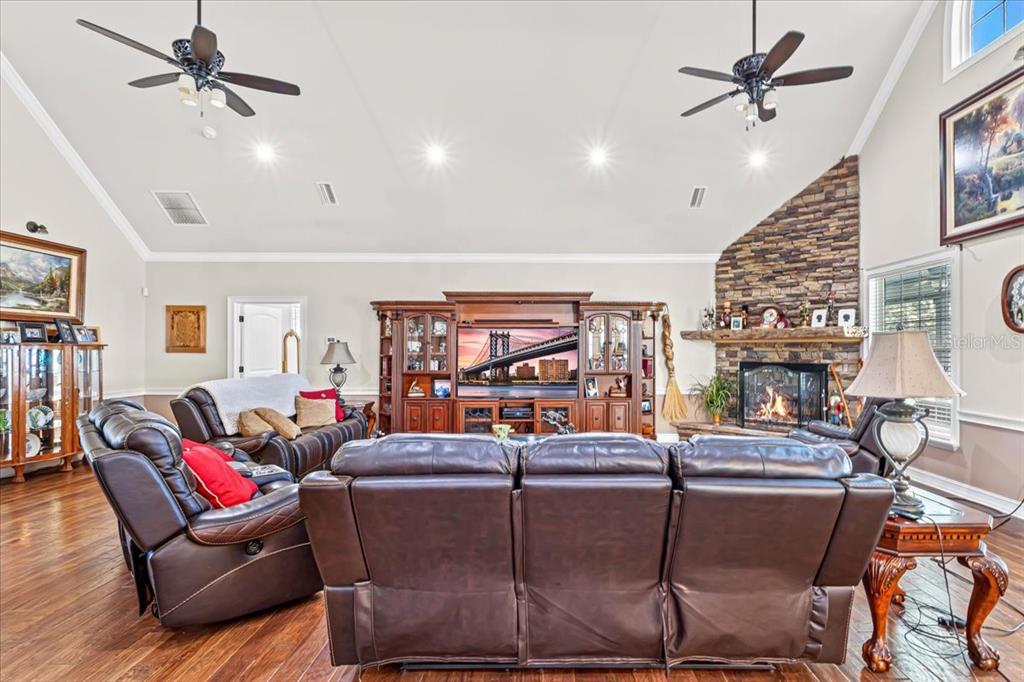 4107 Southwest State Road 45 Newberry, FL 32669 - Photo 21 of 100 a living room with fireplace furniture and a rug
