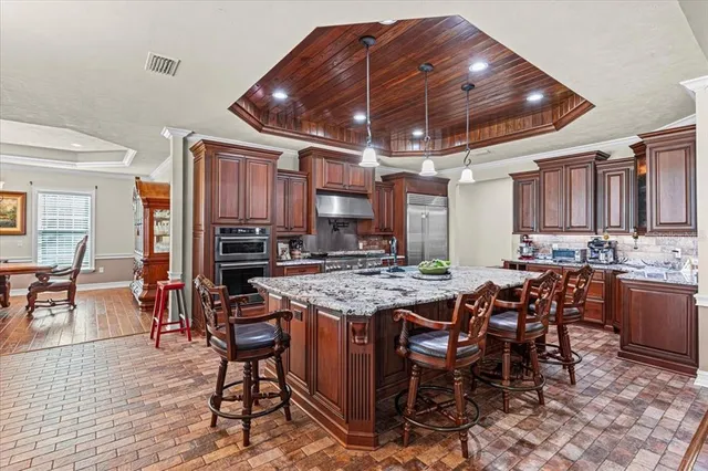 a room with furniture and a ceiling fan