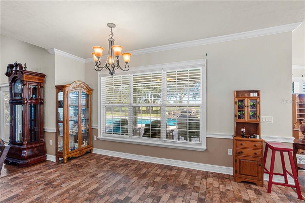 4107 Southwest State Road 45 Newberry, FL 32669 - Photo 29 of 100 a view of a livingroom with wooden floor and windows