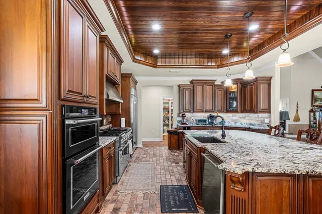 a view of a house with a yard and pathway