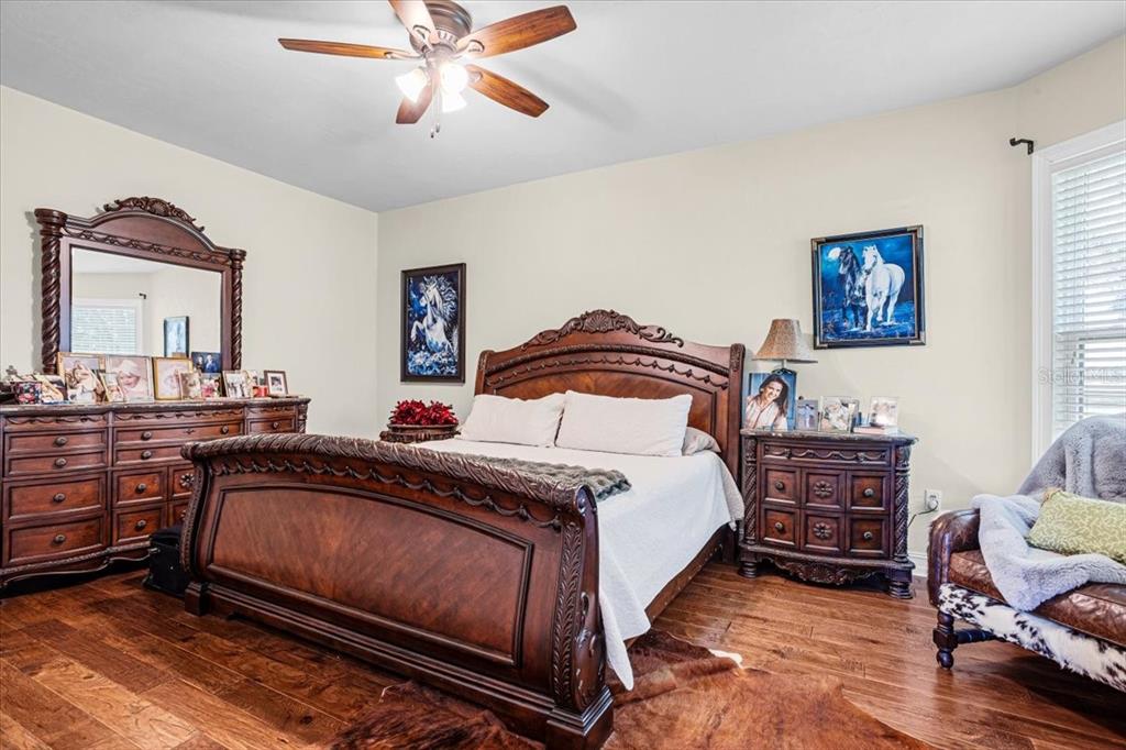 4107 Southwest State Road 45 Newberry, FL 32669 - Photo 43 of 100 a bedroom with a bed and a dresser in it