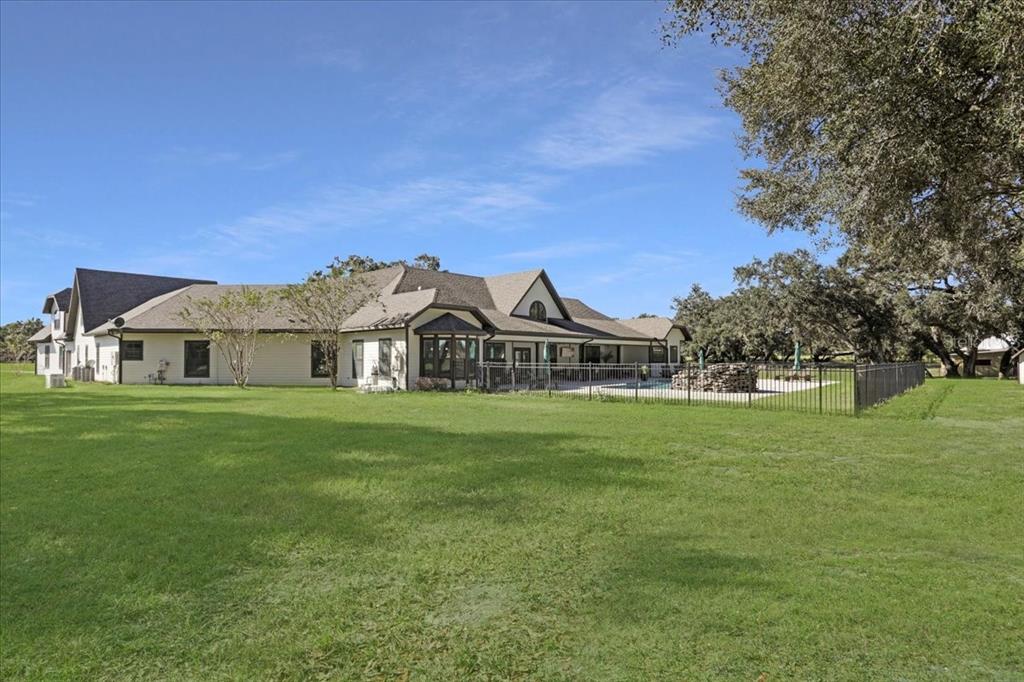 4107 Southwest State Road 45 Newberry, FL 32669 - Photo 6 of 100 a front view of a house with a garden