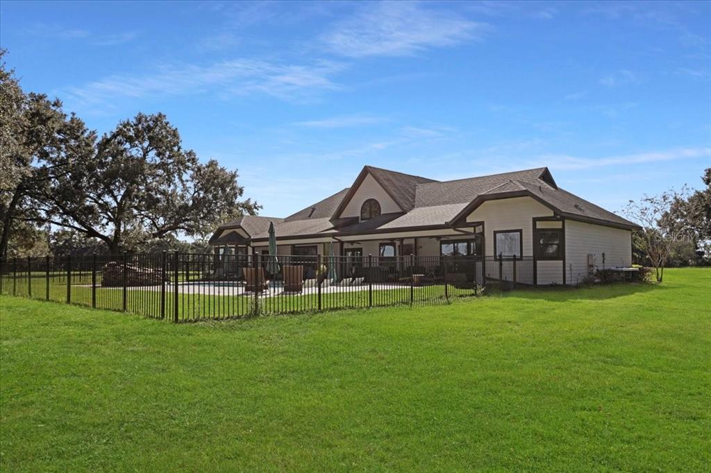4107 Southwest State Road 45 Newberry, FL 32669 - Photo 63 of 100 a view of a house with a big yard and large trees