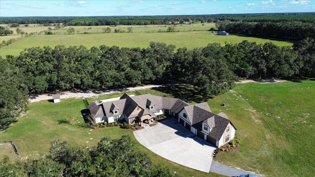 4107 Southwest State Road 45 Newberry, FL 32669 - Photo 71 of 100 an aerial view of a house with a yard and lake view
