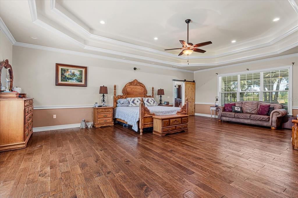 4107 Southwest State Road 45 Newberry, FL 32669 - Photo 8 of 100 a living room with furniture and a wooden floor