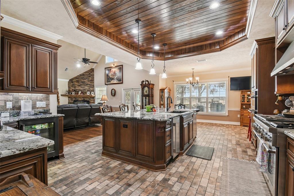 4107 Southwest State Road 45 Newberry, FL 32669 - Photo 96 of 100 a kitchen with stainless steel appliances granite countertop a stove a sink and a refrigerator