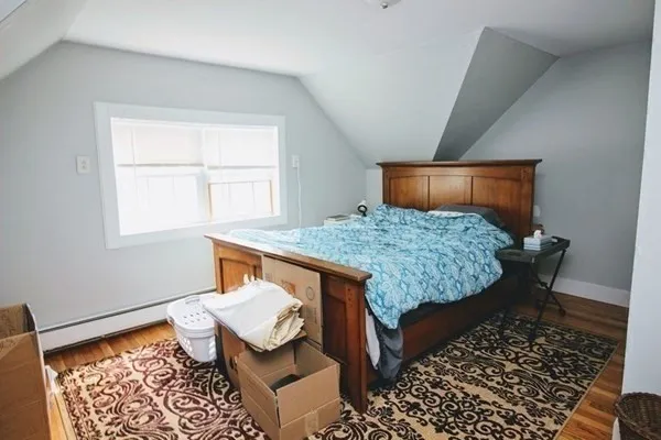 a bed room with a bed and a table