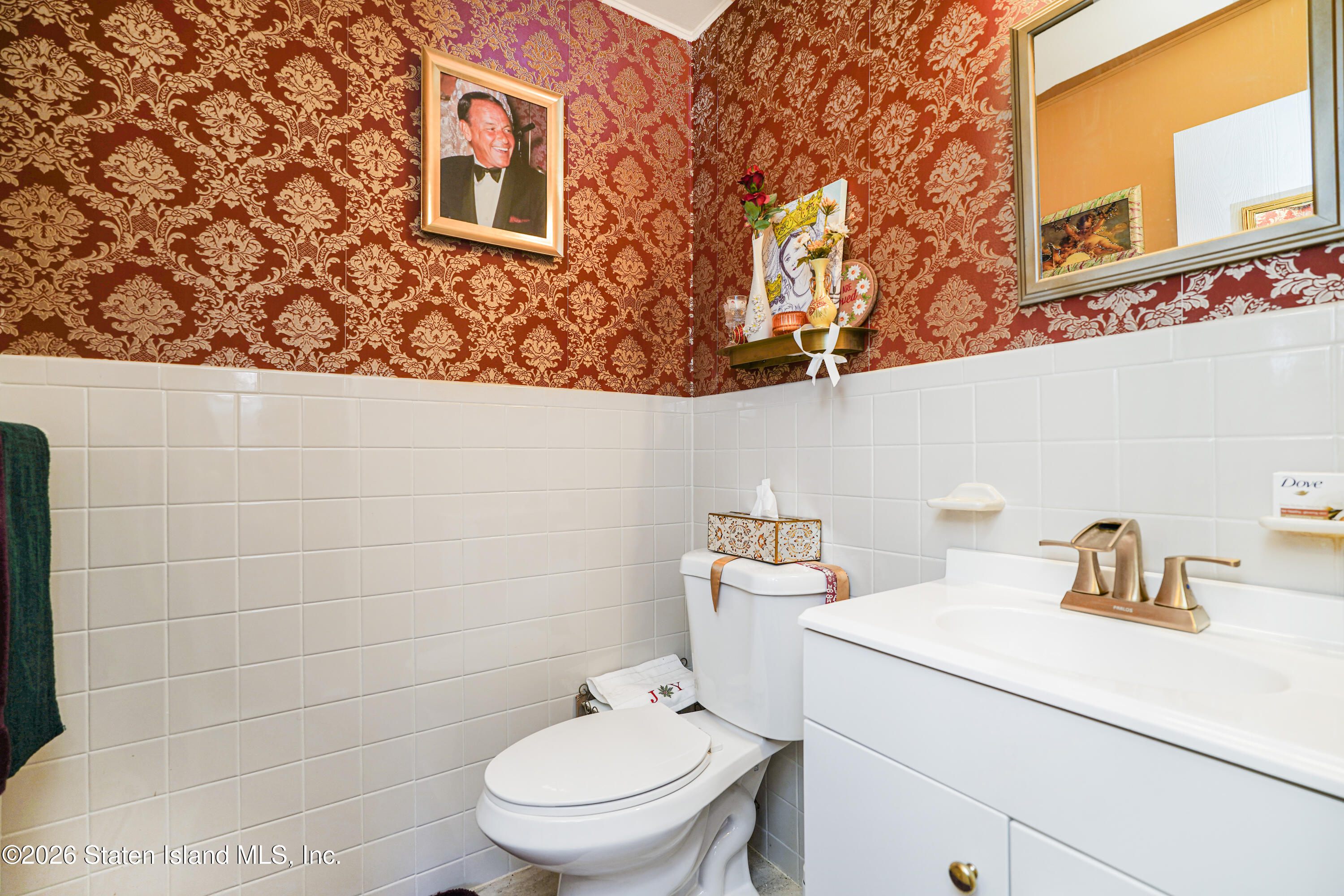 120 Devon Loop, Unit 6 Staten Island, NY 10314 - Photo 11 of 19 a bathroom with a toilet sink and mirror