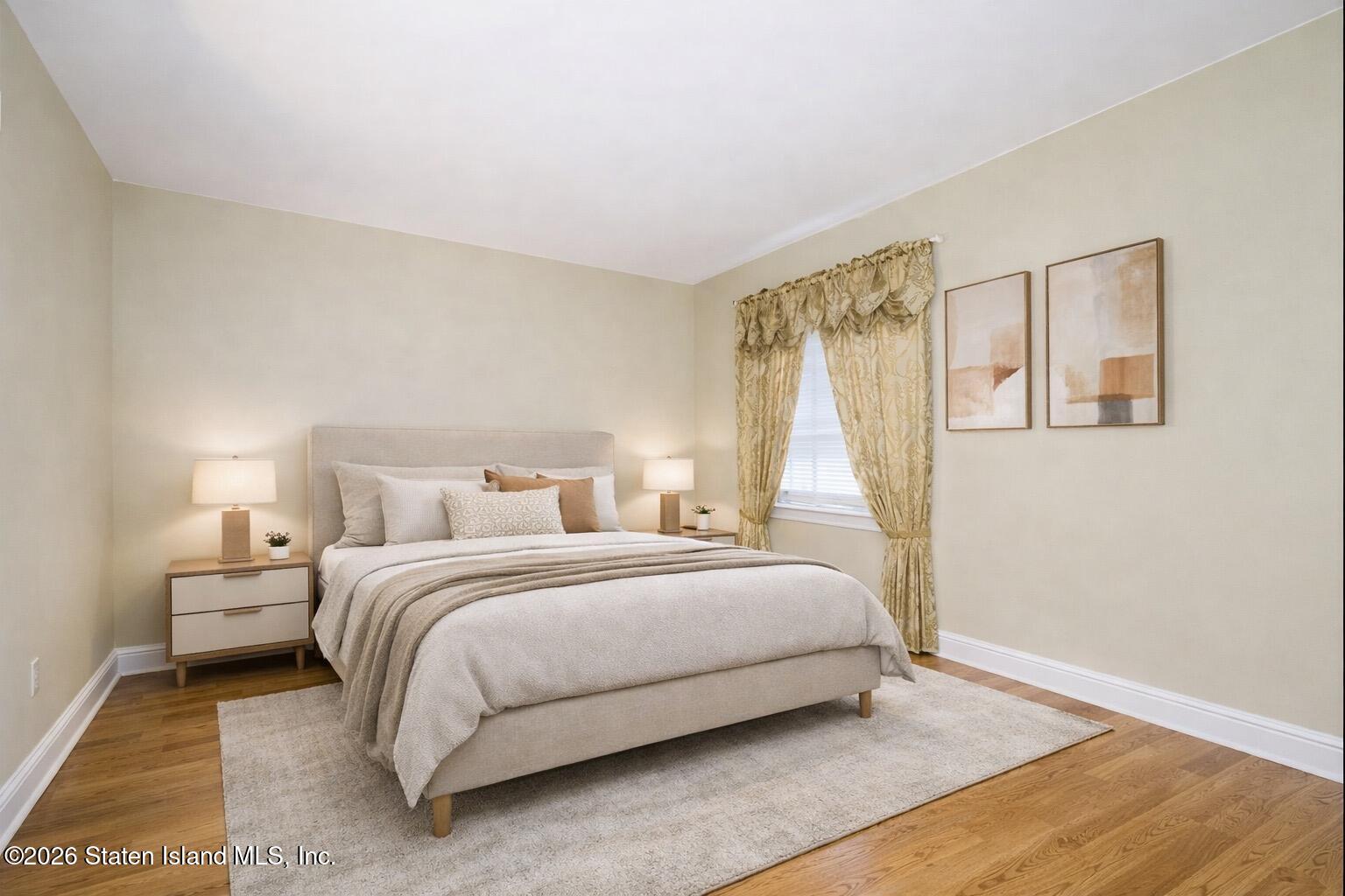 120 Devon Loop, Unit 6 Staten Island, NY 10314 - Photo 12 of 19 a bedroom with a bed and a window