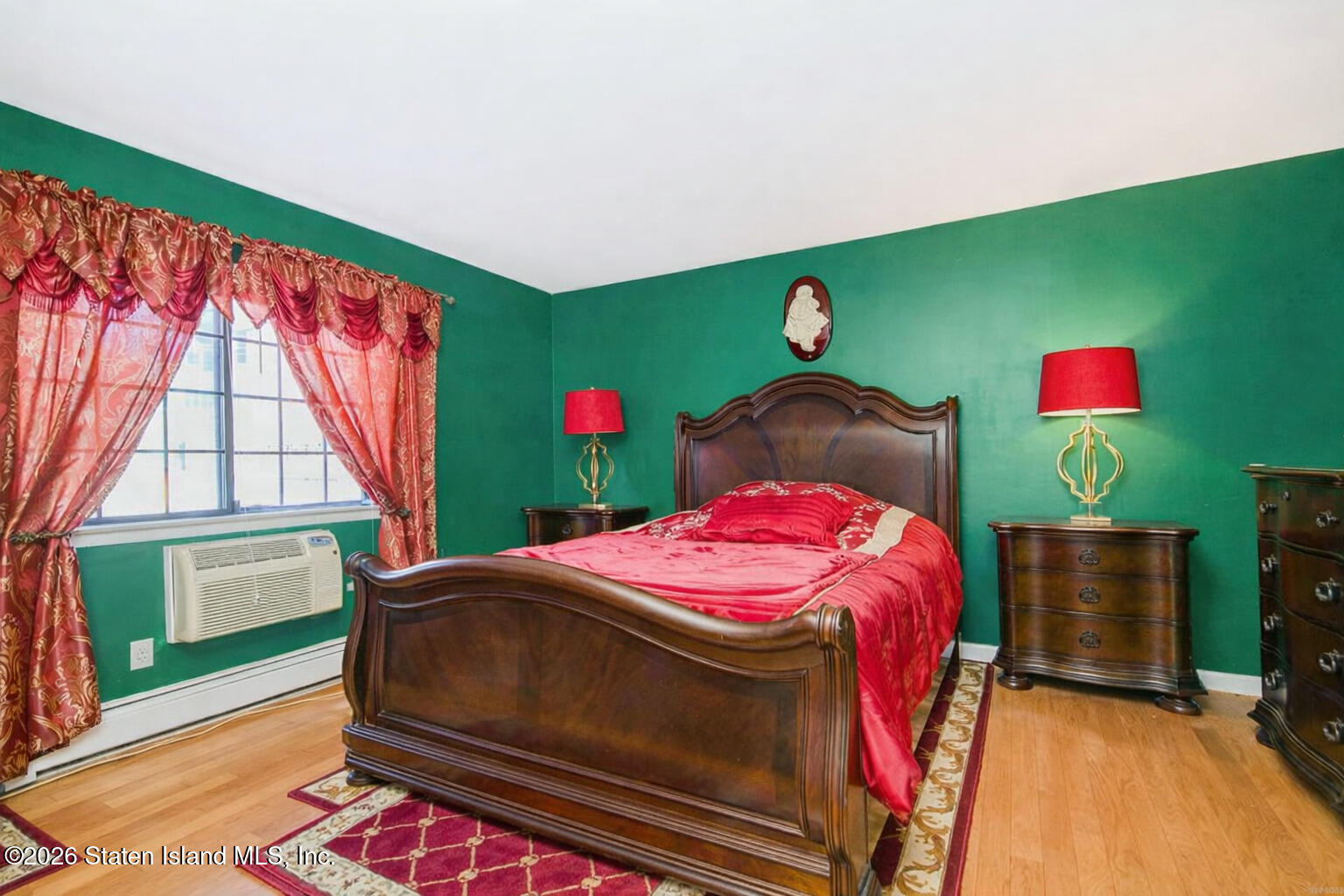 120 Devon Loop, Unit 6 Staten Island, NY 10314 - Photo 15 of 19 a bedroom with a bed and a window