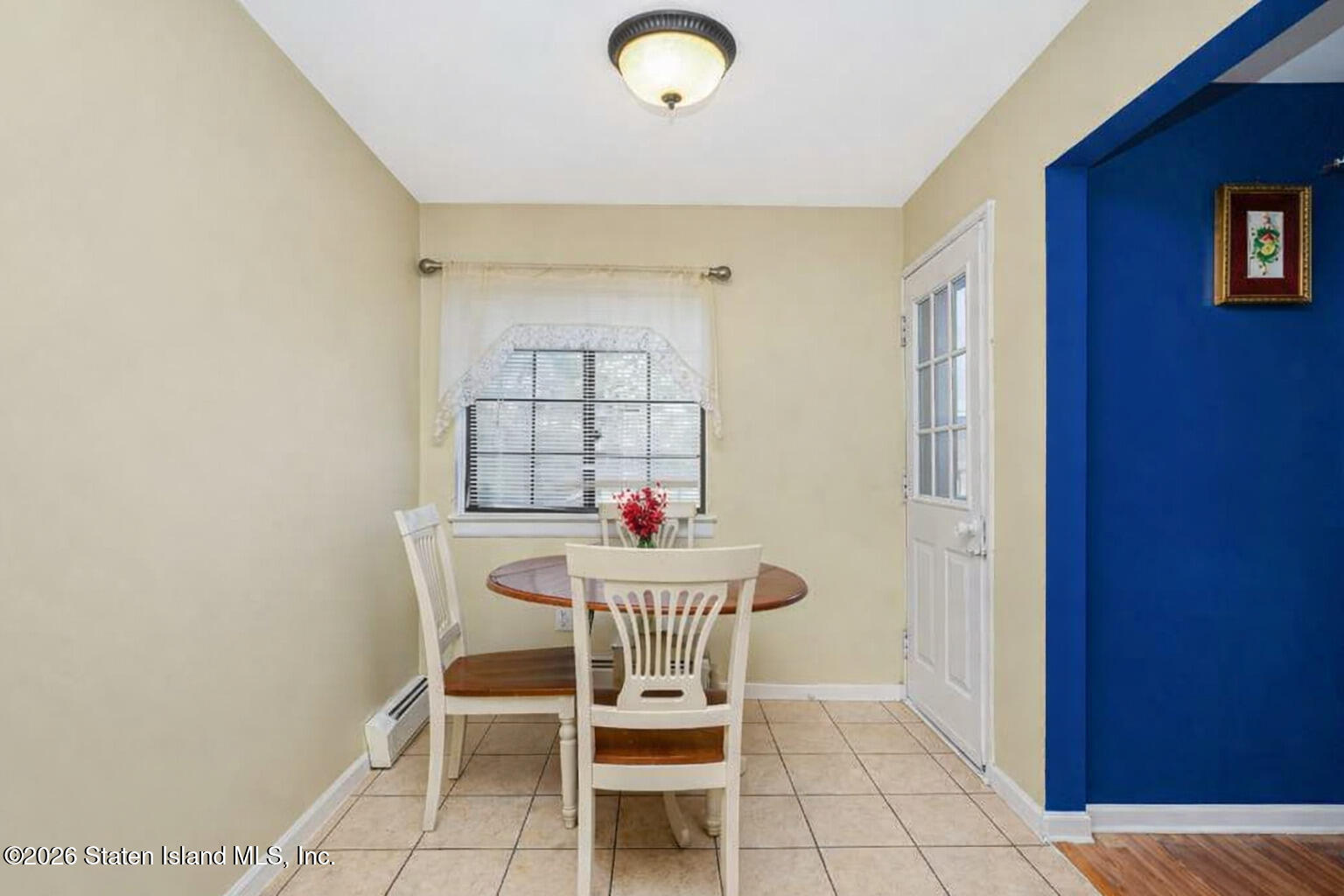 120 Devon Loop, Unit 6 Staten Island, NY 10314 - Photo 8 of 19 a dining room with furniture and window