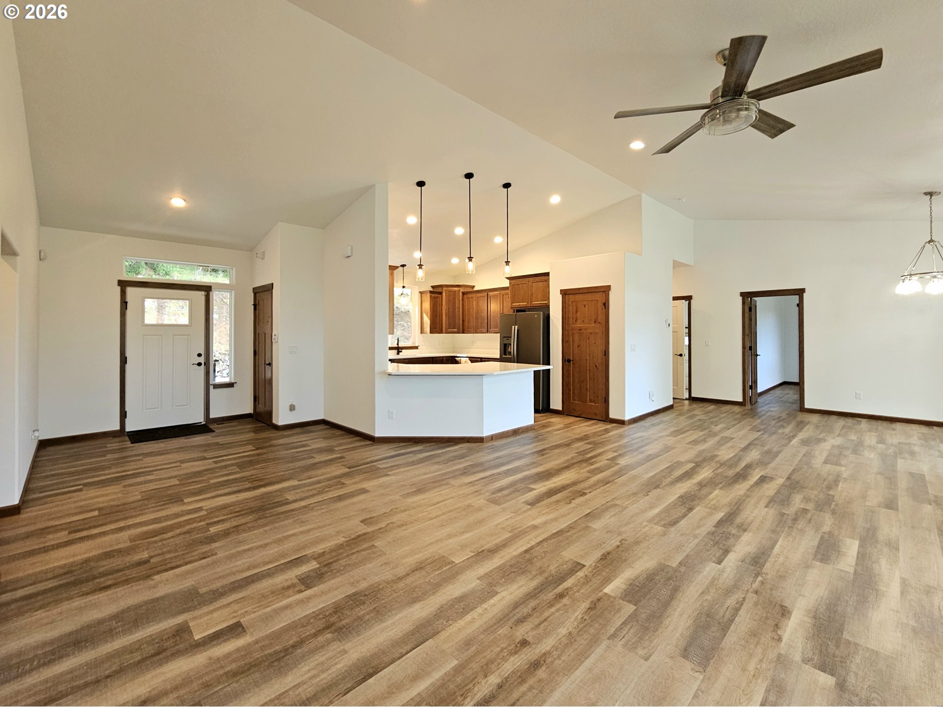 98205 Sunforest Court Brookings, OR 97415 - Photo 11 of 45 a view of a kitchen with a sink and a stove