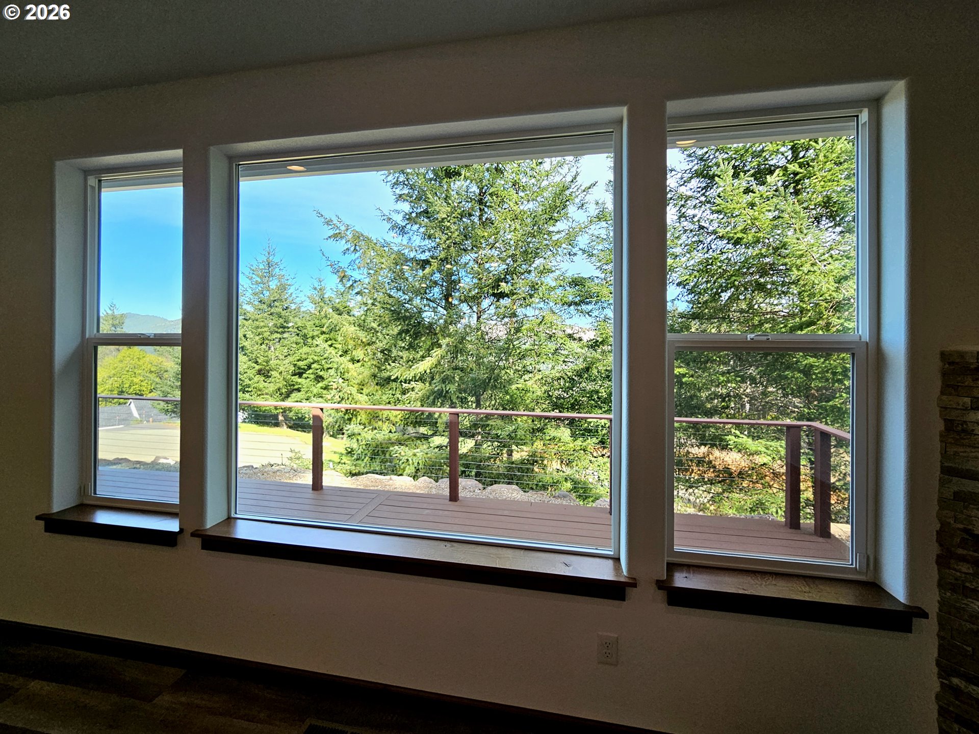 98205 Sunforest Court Brookings, OR 97415 - Photo 13 of 45 a view of a large window with an outdoor space