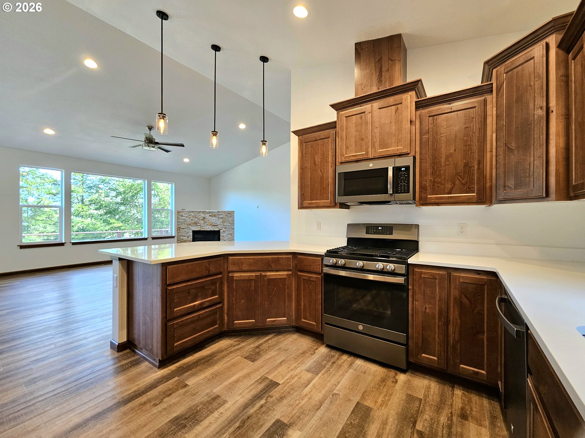 98205 Sunforest Court Brookings, OR 97415 - Photo 17 of 45 a kitchen with stainless steel appliances granite countertop a stove a sink and a microwave