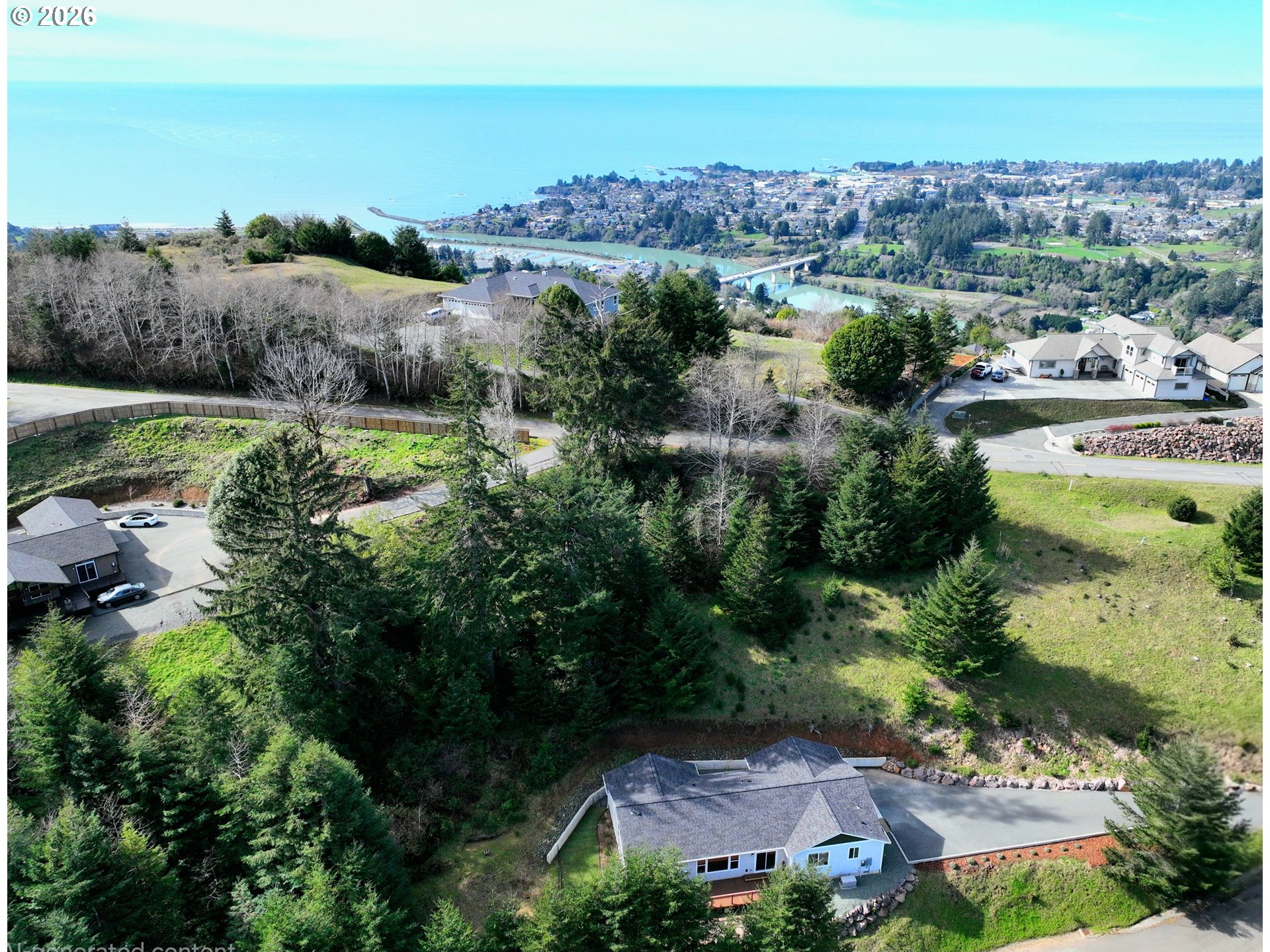 98205 Sunforest Court Brookings, OR 97415 - Photo 2 of 45 an aerial view of a houses with a lake view