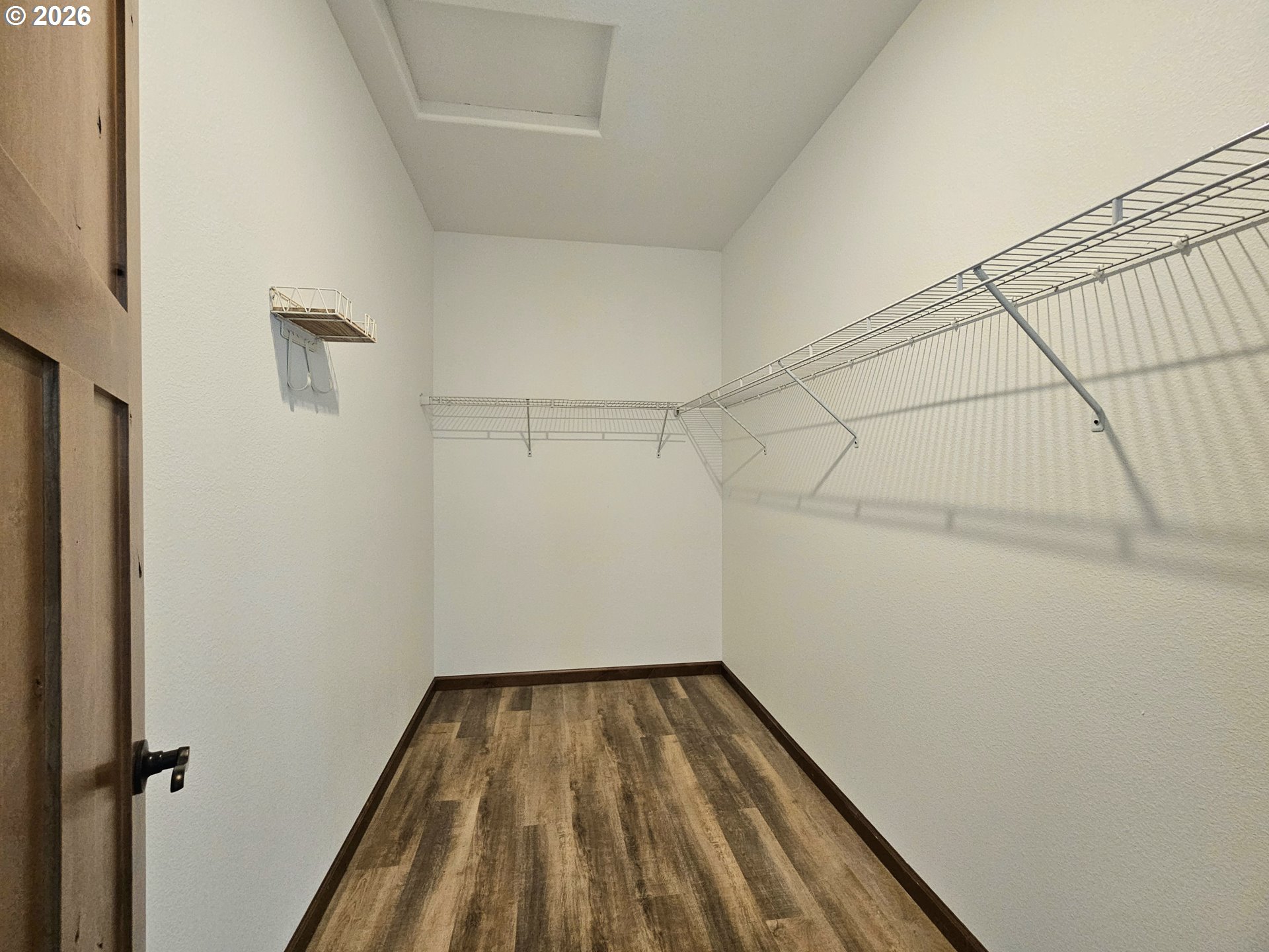 98205 Sunforest Court Brookings, OR 97415 - Photo 23 of 45 a view of a room with wooden floor